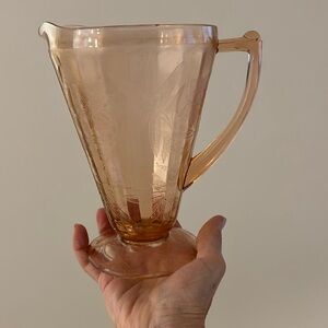 Pink Jeanette depression glass pitcher.